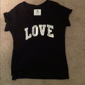 Black shirt - sequence lettering “love”